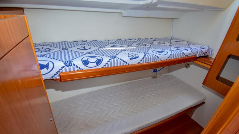 Bunk bed in a cabin with a minimalist design on a yacht