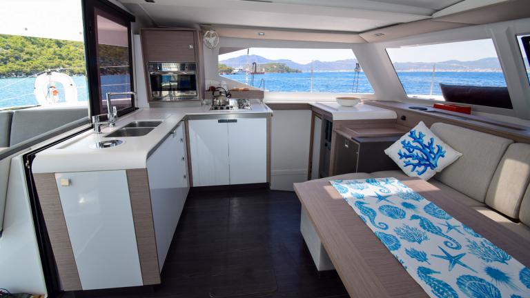 Bright equipped catamaran kitchen