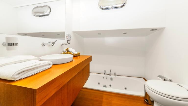 The elaborately designed bathroom of a luxury boat.