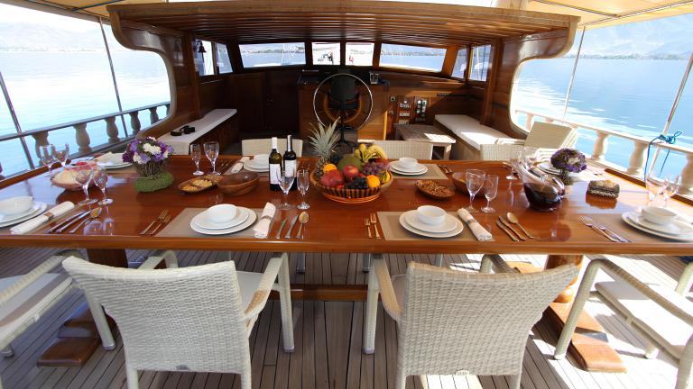 An elegantly laid dining table on the deck of the gulet Prenses Selin.