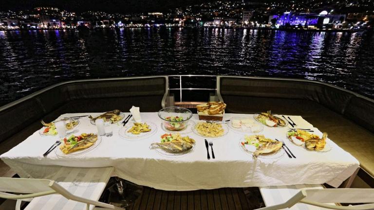 The aft deck dining table of the motor yacht Juliet.
