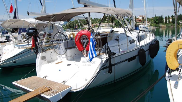 Rear view of sailing yacht Anemos docked at the marina and ready to sail.