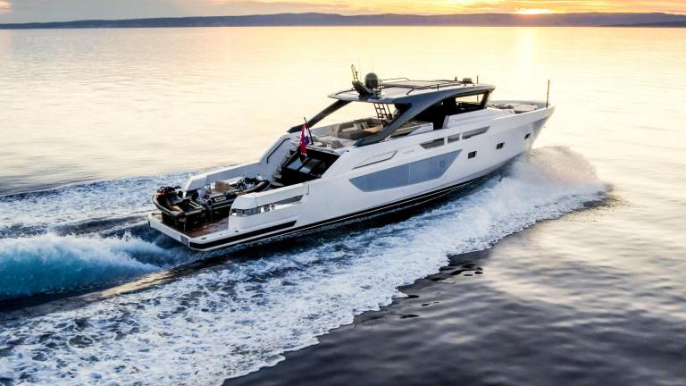 Motor yacht Kimani Bluegame BG74 glides through Split waters at sunset with refined design and performance.