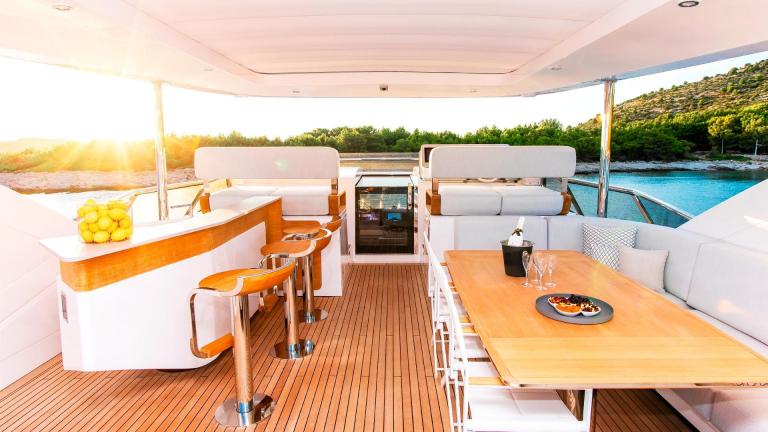 Stylish dining area on the 27-meter motor yacht Dawo in Sibenik, perfect for outdoor meals.