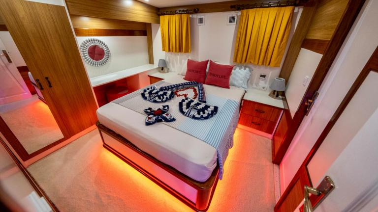 Tastefully furnished cabin with cosy bed and maritime decoration on the gulet Enjoy Life.