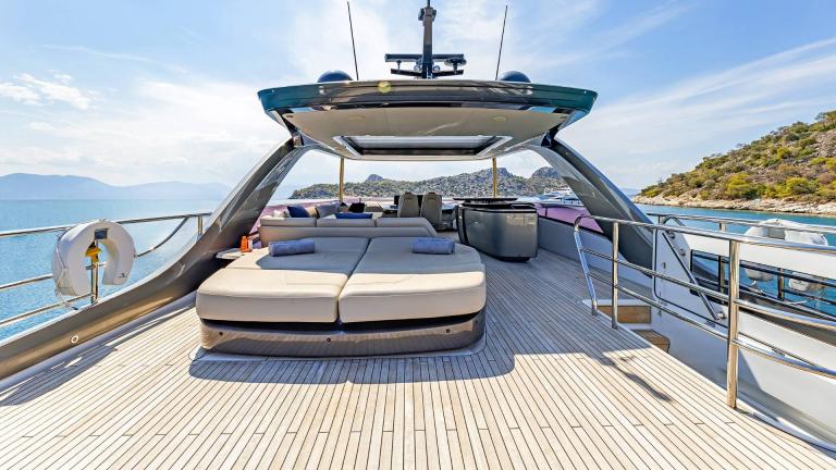 Spacious sun lounger on a motorboat with stunning views of the Greek islands.