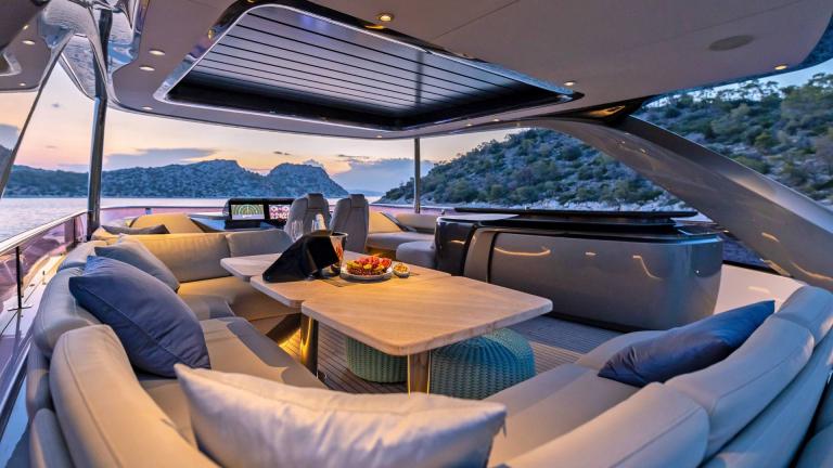 Stylish dining area on a yacht with breathtaking views of the Greek islands.