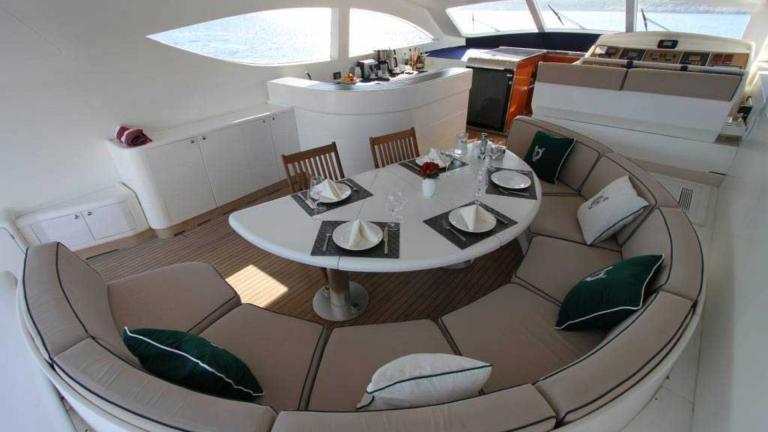 Deck dining table of luxury motor yacht Mina II