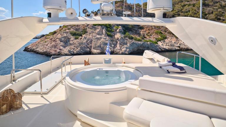 Relax in the hot tub on the flybridge of a motor yacht with stunning sea views