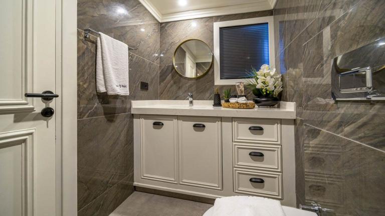 Stylish and well-equipped bathroom on the sailing yacht Queen of Makri with elegant decor.