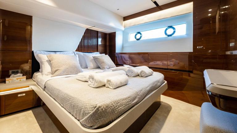 Comfortable bedroom with elegant furnishings on a yacht.