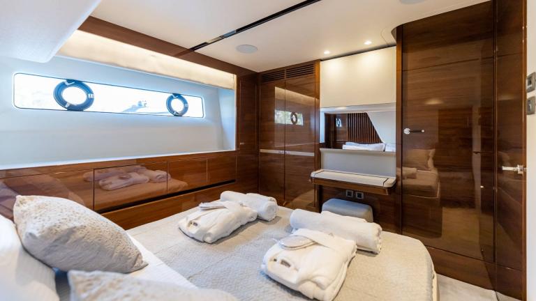 Modernly furnished bedroom with luxurious details on a yacht.