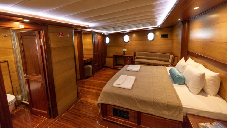Spacious and luxurious main cabin of a traditional Turkish gulet with five cabins, perfect for a comfortable overnight s