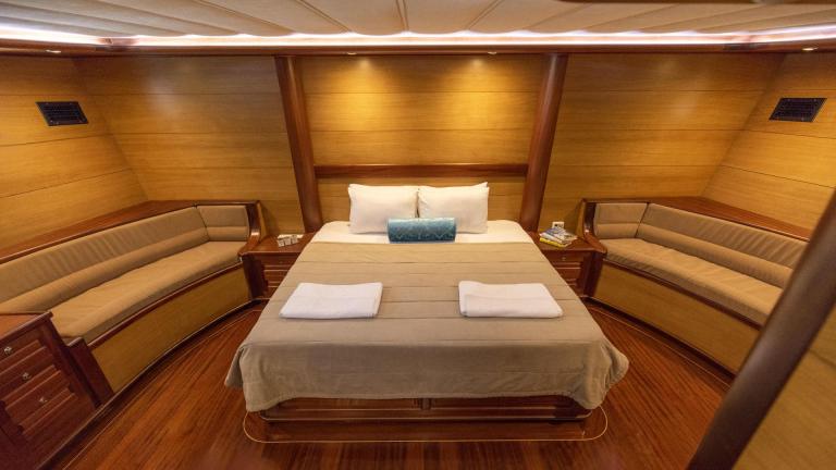 Stylish and comfortable bow cabin of a traditional Turkish gulet.