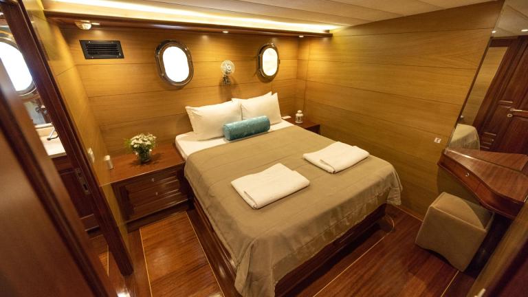 Comfortable and stylishly furnished guest cabin of a traditional Turkish gulet with five cabins.