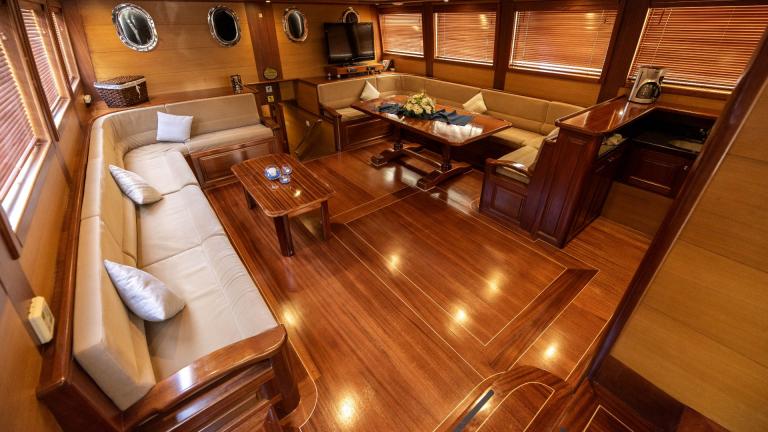 Elegant and spacious saloon area of a traditional Turkish gulet with five cabins, equipped for maximum comfort and relax