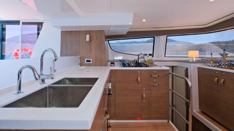 The catamaran's practical kitchen area helps guests prepare unforgettable meals.