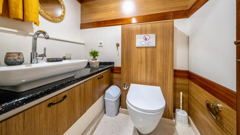 Bathroom with modern fittings and wood panelling on the Gulet Enjoy Life.