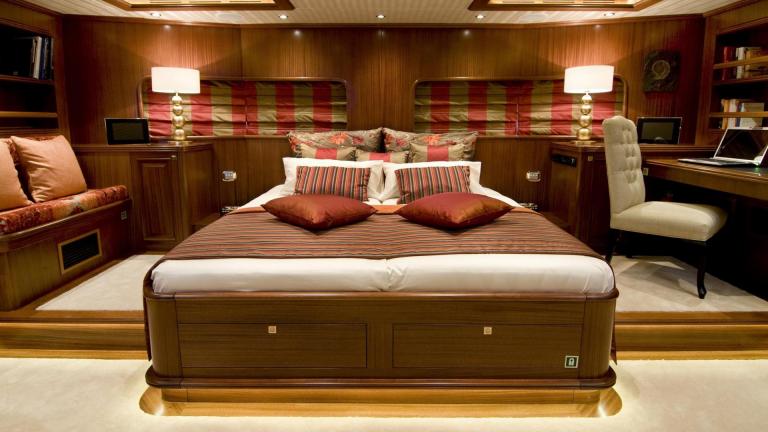 A spacious gulet bedroom. You can see a large double bed