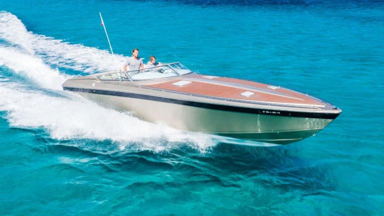 The elegant Follow Me yacht cruising swiftly on the sea.