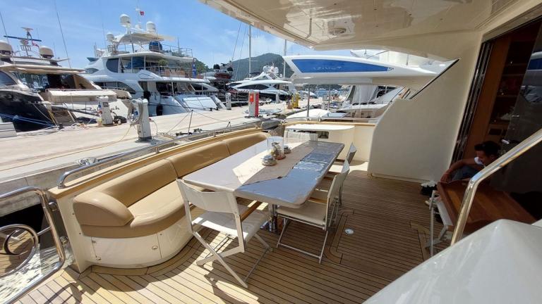 The aft deck dining table of the motor yacht My Way.