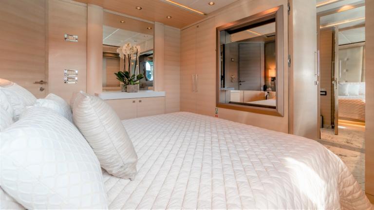 Enjoy the elegant suite of the luxurious motor yacht O'Pati for an unparalleled experience at sea.