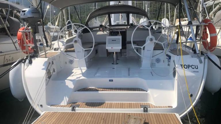 The aft deck of Topcu yacht is equipped with a helm and seating areas.