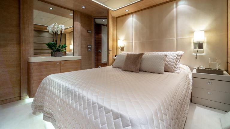 Enjoy the luxurious cabin of the motor yacht O'Pati for a restful sleep on the high seas.