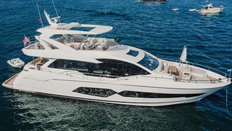 Lady M motor yacht is anchored in the blue waters off the coast of Mallorca.