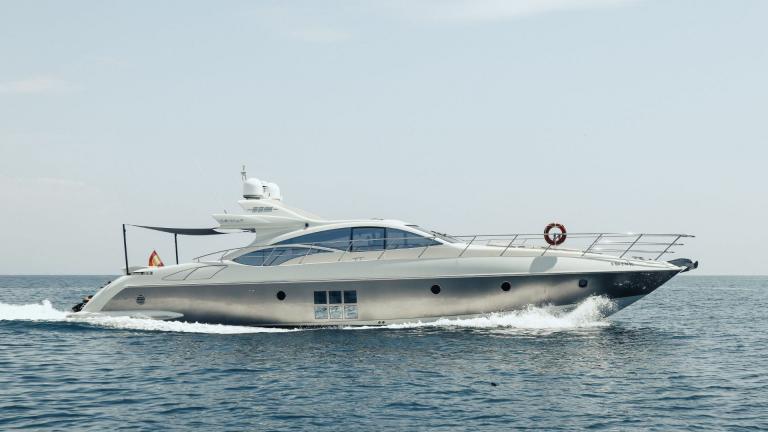 The motor yacht Esperanza cruising swiftly on open sea, showcasing modern lines.