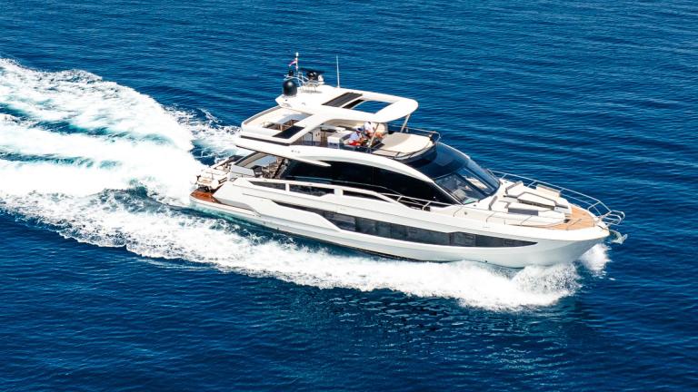 The Yacht FG Star presents a stunning view as it speeds across the blue waters.