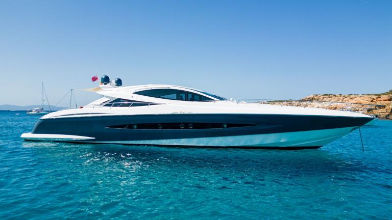 The motor yacht Funky Town stands out with its sleek and modern design on the blue waters.