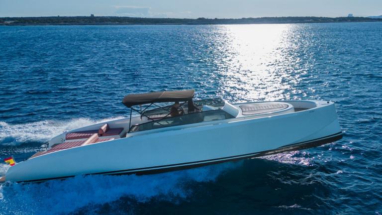 The Tequila motor yacht speeds through the blue sea, featuring comfortable sunbathing areas and stylish design.