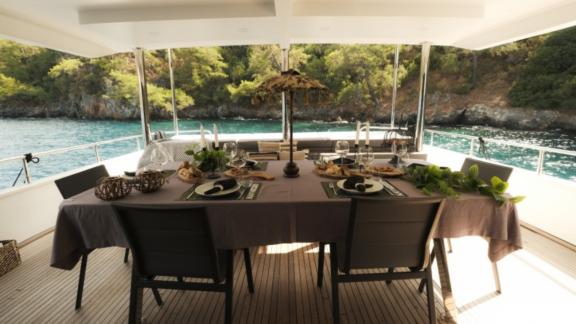 A set dinner table for the guests of the motor yacht Nayk