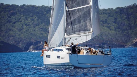 Sky Asya yacht enjoying a sail on the blue sea with sails up.