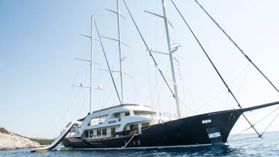 The impressive Meira sailing yacht peacefully anchored in a quiet bay.