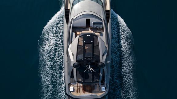 An image of a motor yacht's flybridge and teak details on the deck.