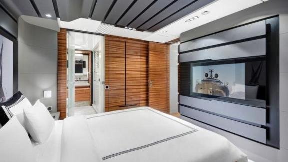 The bedroom of a modern yacht designed with the harmony of gray, white and black colors.