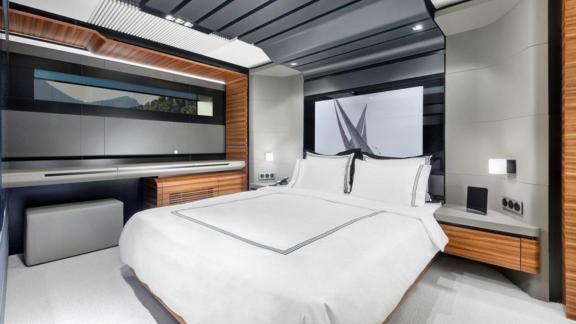 Spacious cabin of a rental superyacht and its view.