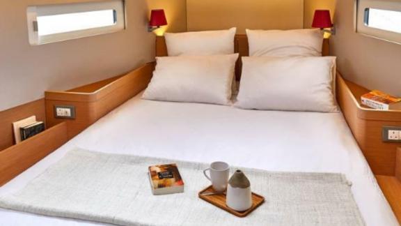 Sky Asya yacht's double cabin with cozy pillows and modern decor.