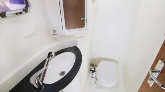 This compact bathroom on the catamaran Vira Seyyah offers a functional and clean space.