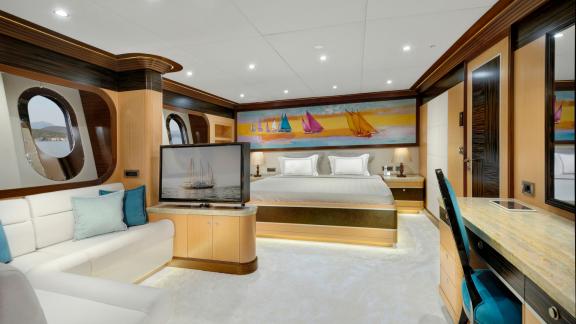 Comfortable guest cabin of the Meira sailing yacht with modern design and cozy seating area.