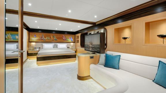 Elegant guest cabin of the Meira sailing yacht with cozy seating area and modern amenities.