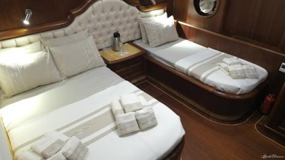 Triple cabin on the gulet. You can see a double bed and a single bed