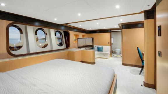 Generous guest cabin of the Meira sailing yacht with panoramic windows and modern amenities.