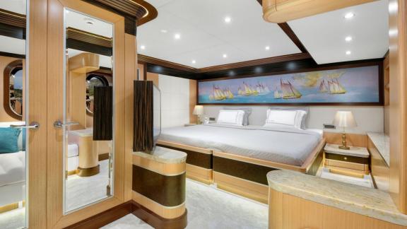 Exclusive suite on the Meira sailing yacht with spacious bed and stylish decor.