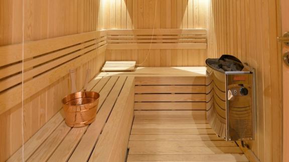 Relax in the luxurious sauna of the Meira sailing yacht with elegant wood finish.