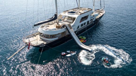 The Meira sailing yacht offers thrilling water activities with a slide and jet-skis.