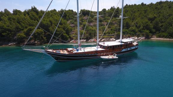 Luxurious gulet Dolce Vita is moored in the bay, next to the boat