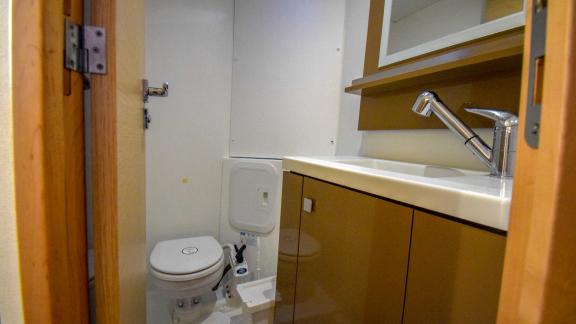 Bathroom on the catamaran Sky Maria with a spacious sink and mirrored cabinet.